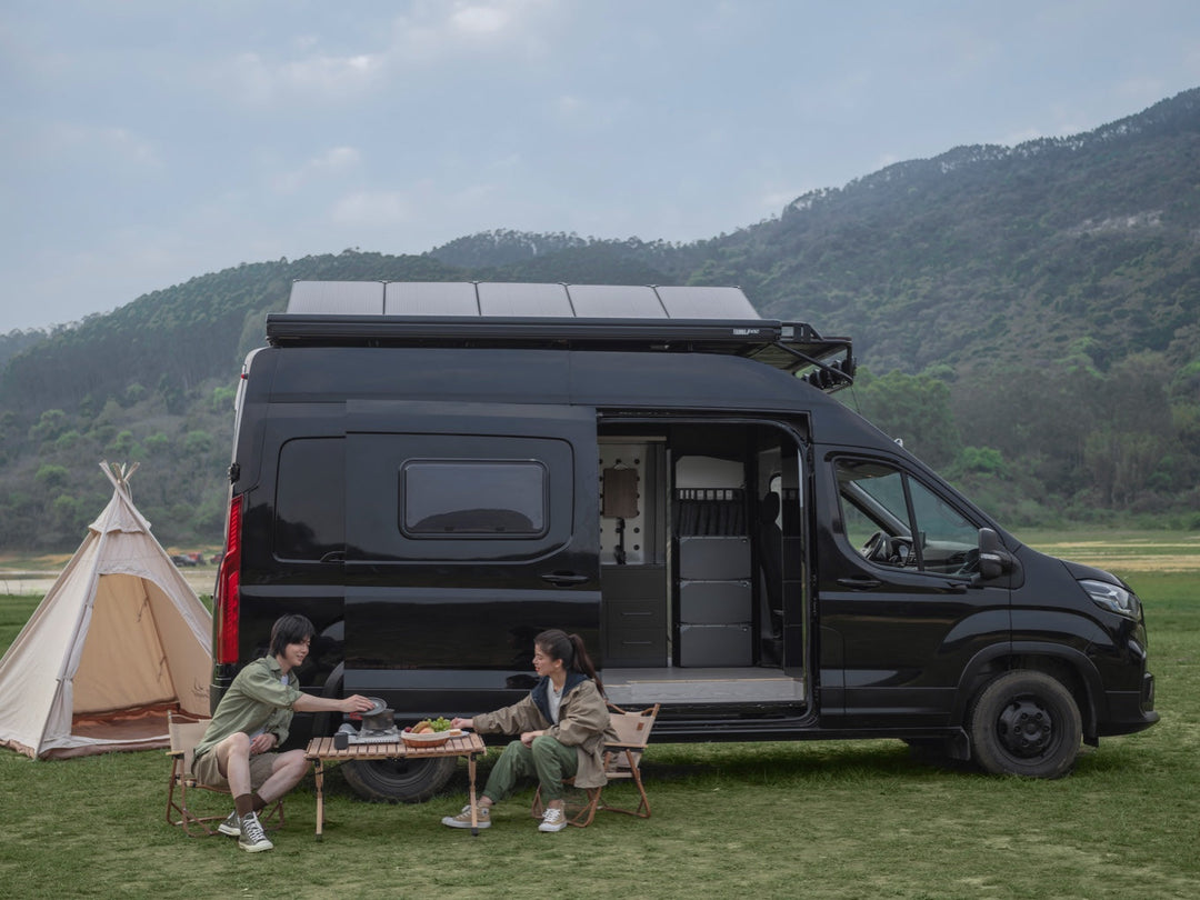 Black RV with EcoFlow power kit parked in nature, showcasing off-grid distribution solutions for tiny homes and mobile living.