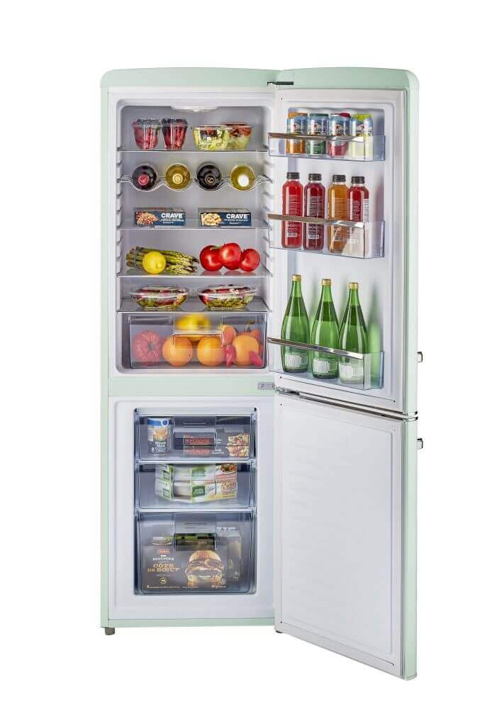 Retro-style 9 cu/ft bottom mount refrigerator with open door, filled with fruits, vegetables, drinks, and foods.