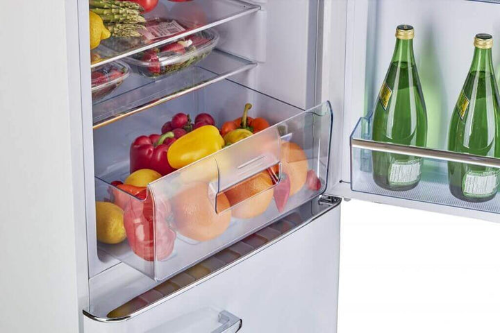 Open Unique 9 cu/ft Retro AC Bottom Mount Refrigerator with organized fresh produce in crisper drawer and bottled drinks in the door.