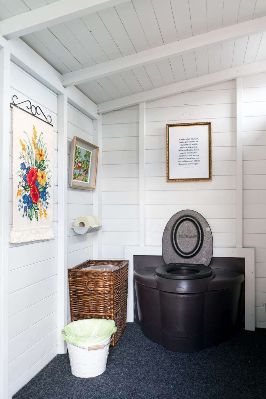 Biolan Populett Composting Toilet in cabin setting, suitable for high use areas. Odorless, hygienic, eco-friendly. Available at Cabin Depot.