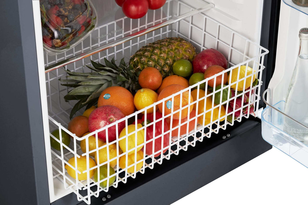 Spacious Unique 14 CU/FT Propane Fridge interior with fruits in storage basket, showcasing ample storage for family needs.