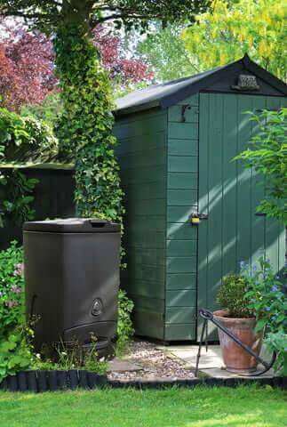 Biolan Biowaste Composter by Cabin Depot in a garden setting, ideal for eco-friendly household waste composting with thermal insulation and natural ventilation.