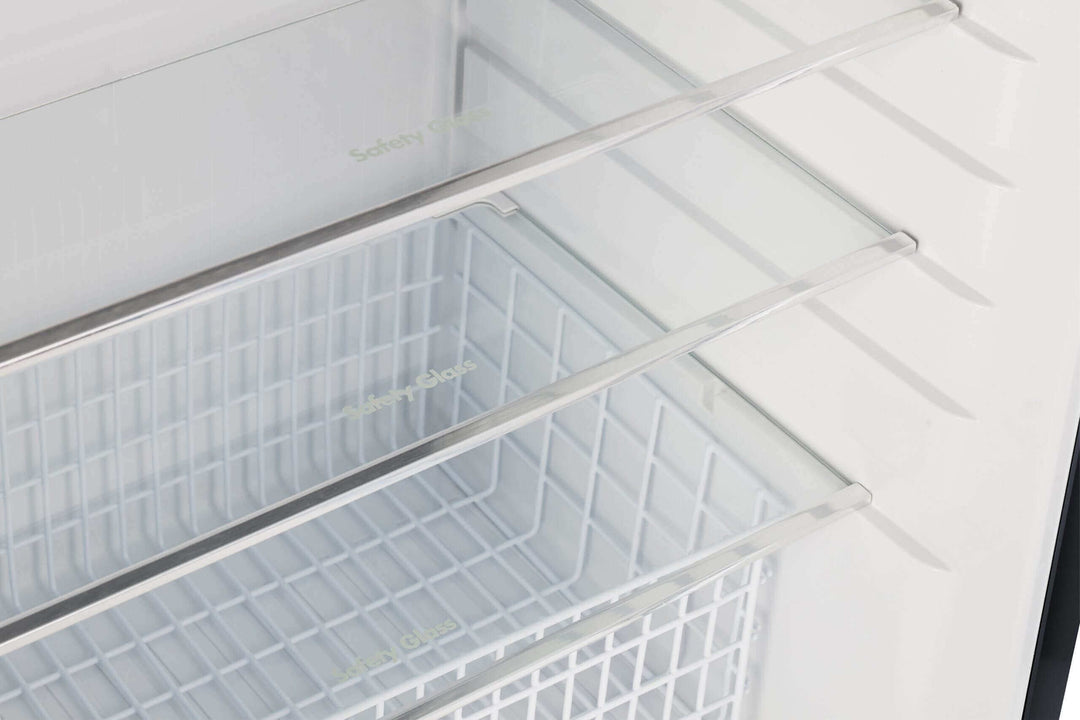 Interior view of Unique 14 CU/FT Propane Fridge showing adjustable glass shelves and ample storage space.